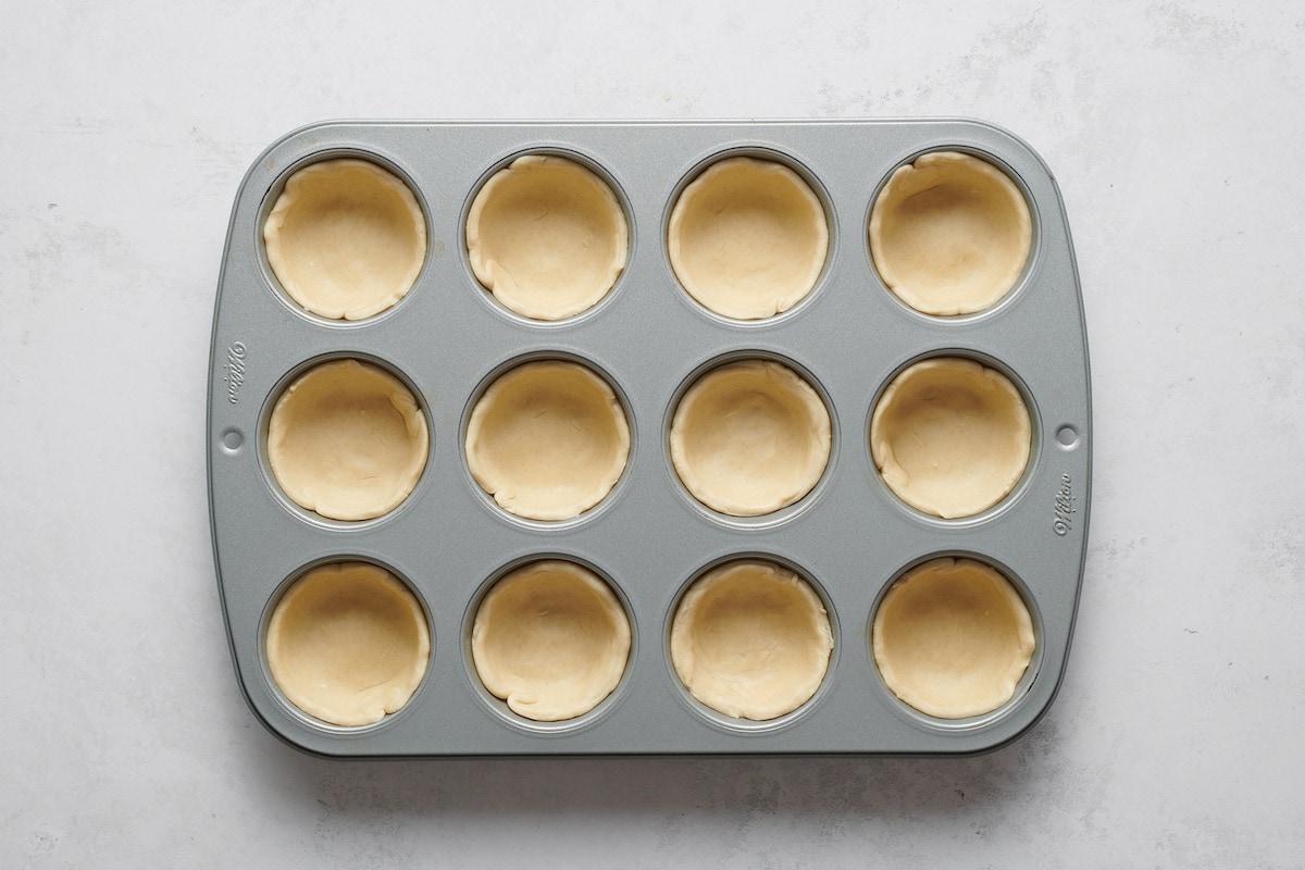 crusts in muffin tin.