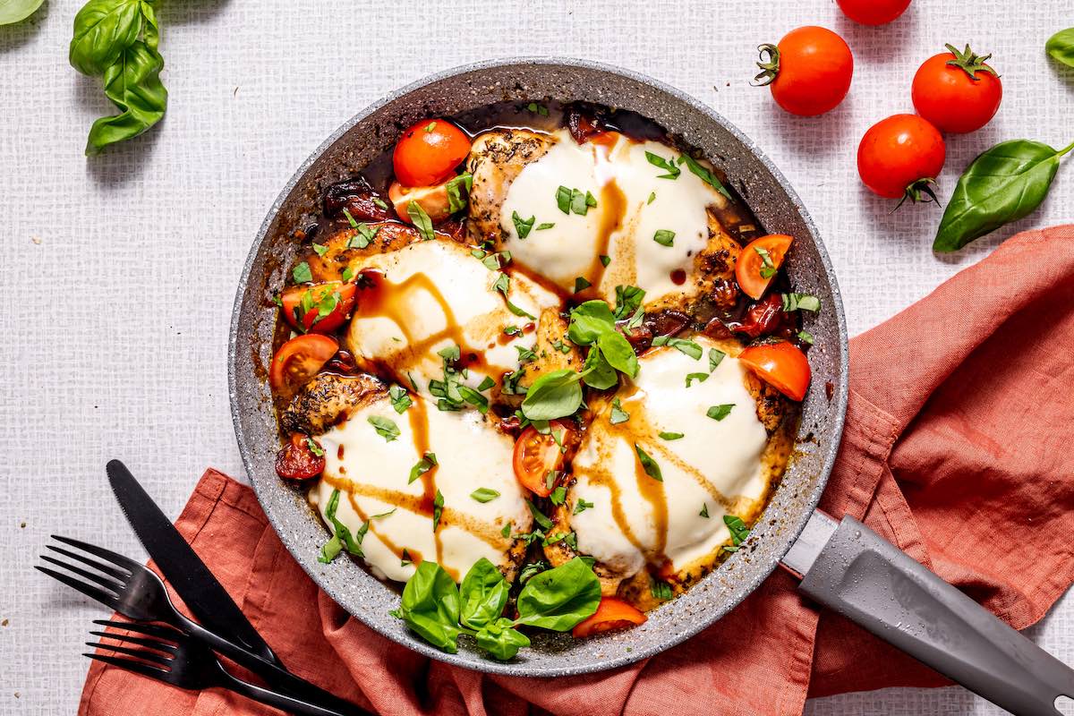 caprese chicken in skillet.