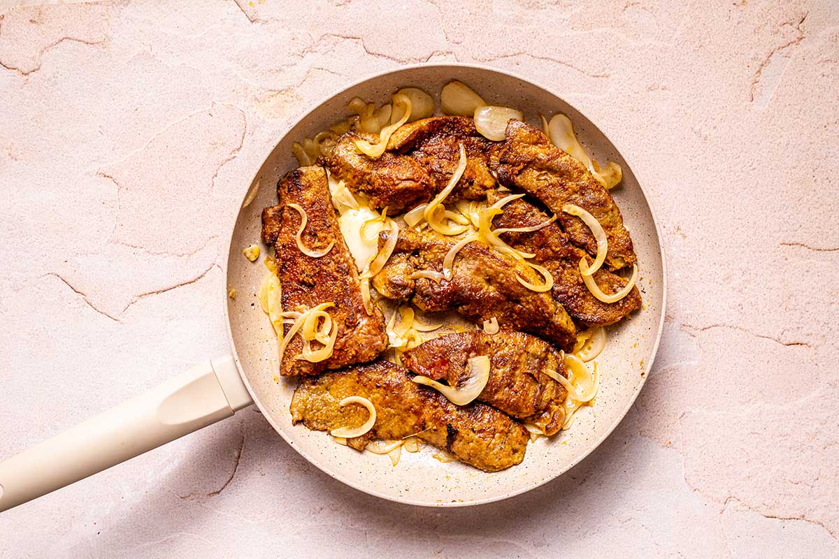 onions and liver in a skillet.