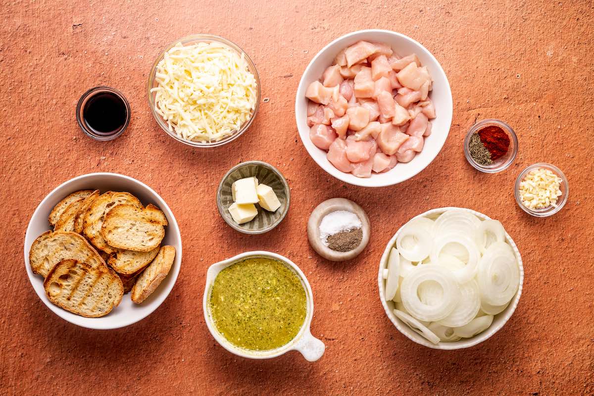 raw chicken and seasonings in bowls. 