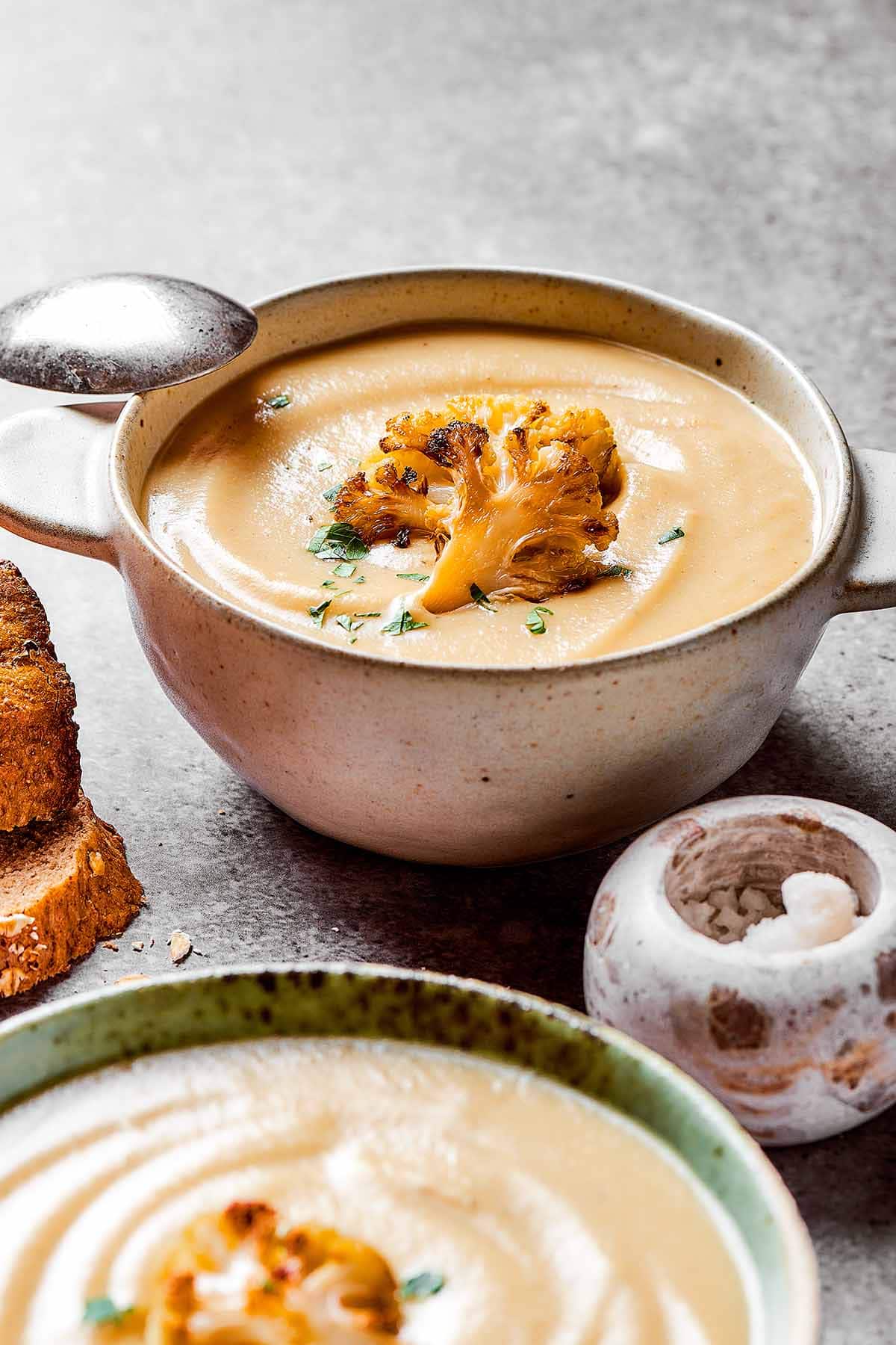roasted cauliflower soup in bowls.