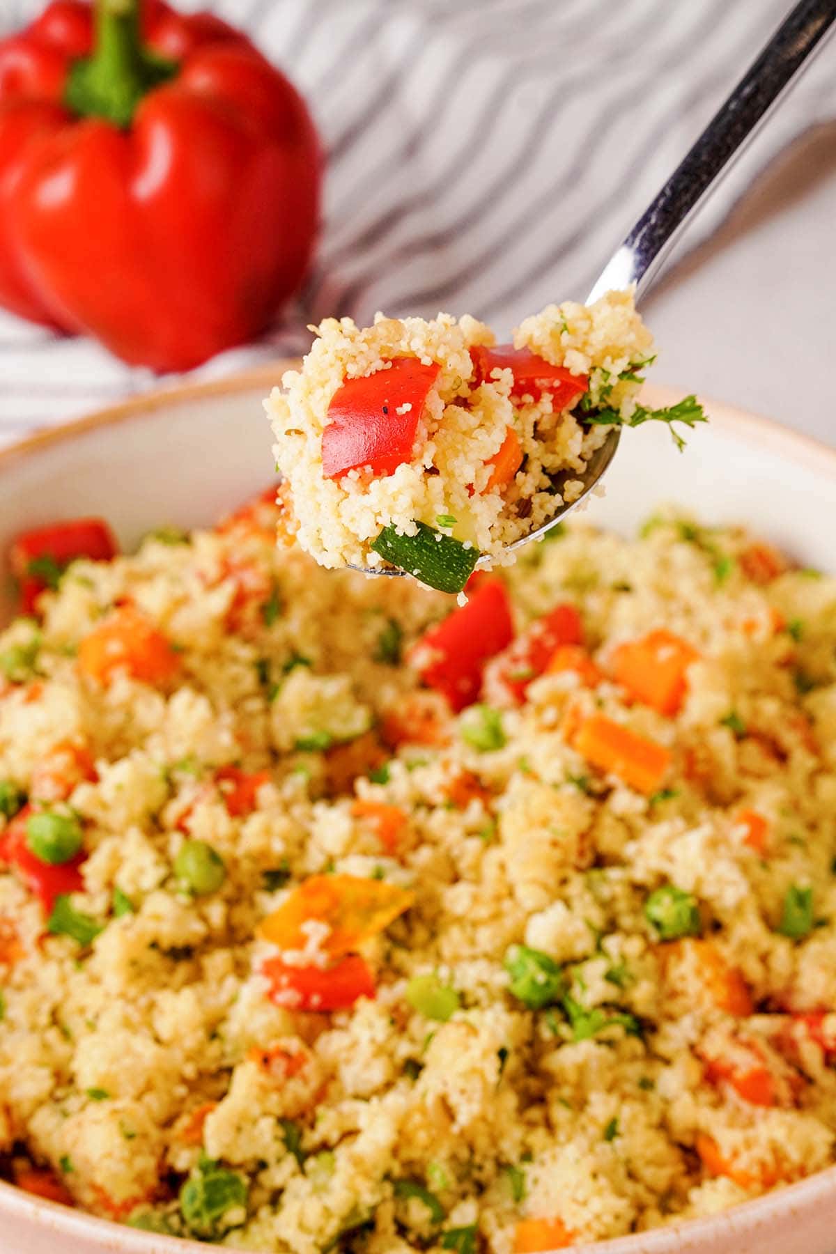 spoonful of couscous with vegetables.