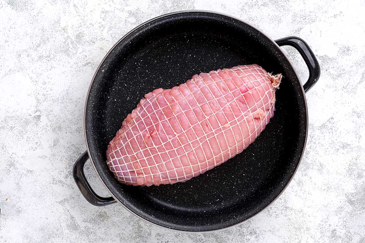 raw boneless turkey breast in a skillet. 