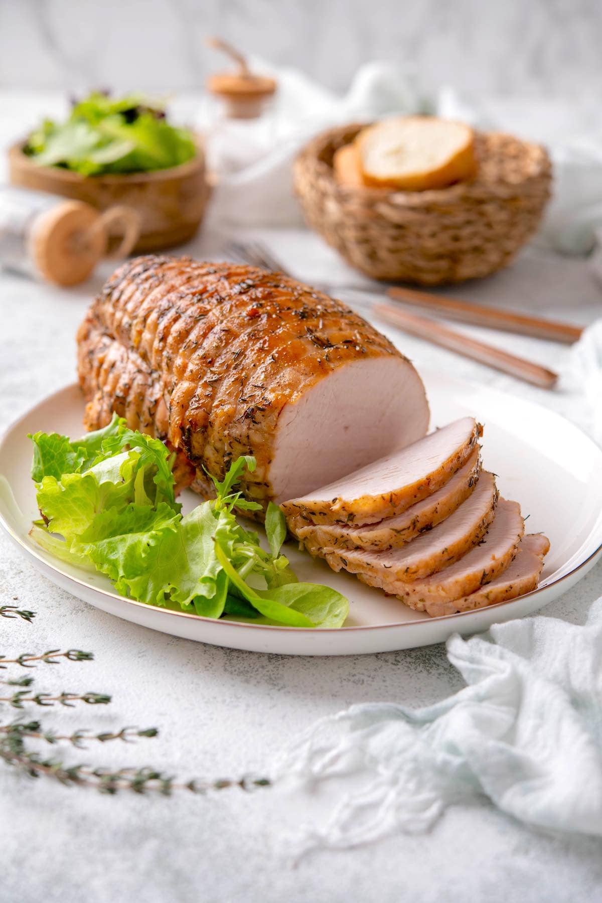 sliced boneless turkey breast on a plate.