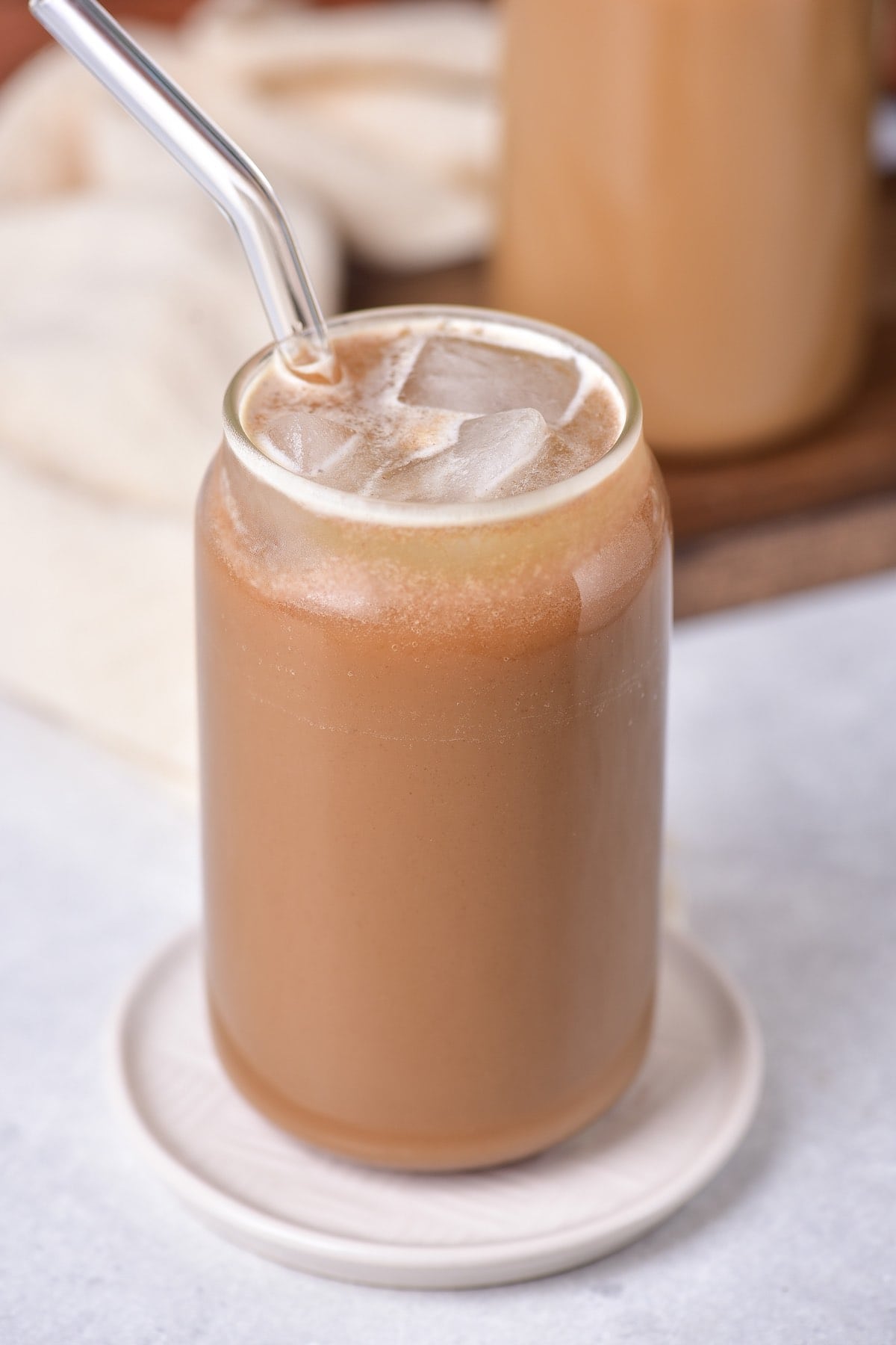 protein coffee in a glass with a straw.