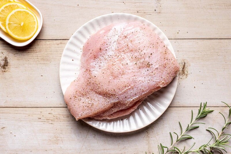 seasoned turkey breast on plate.