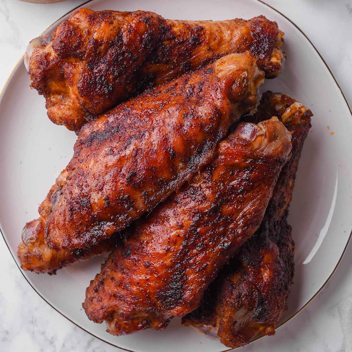 https://thebigmansworld.com/wp-content/uploads/2023/11/smoked-turkey-wings-recipe2.jpg