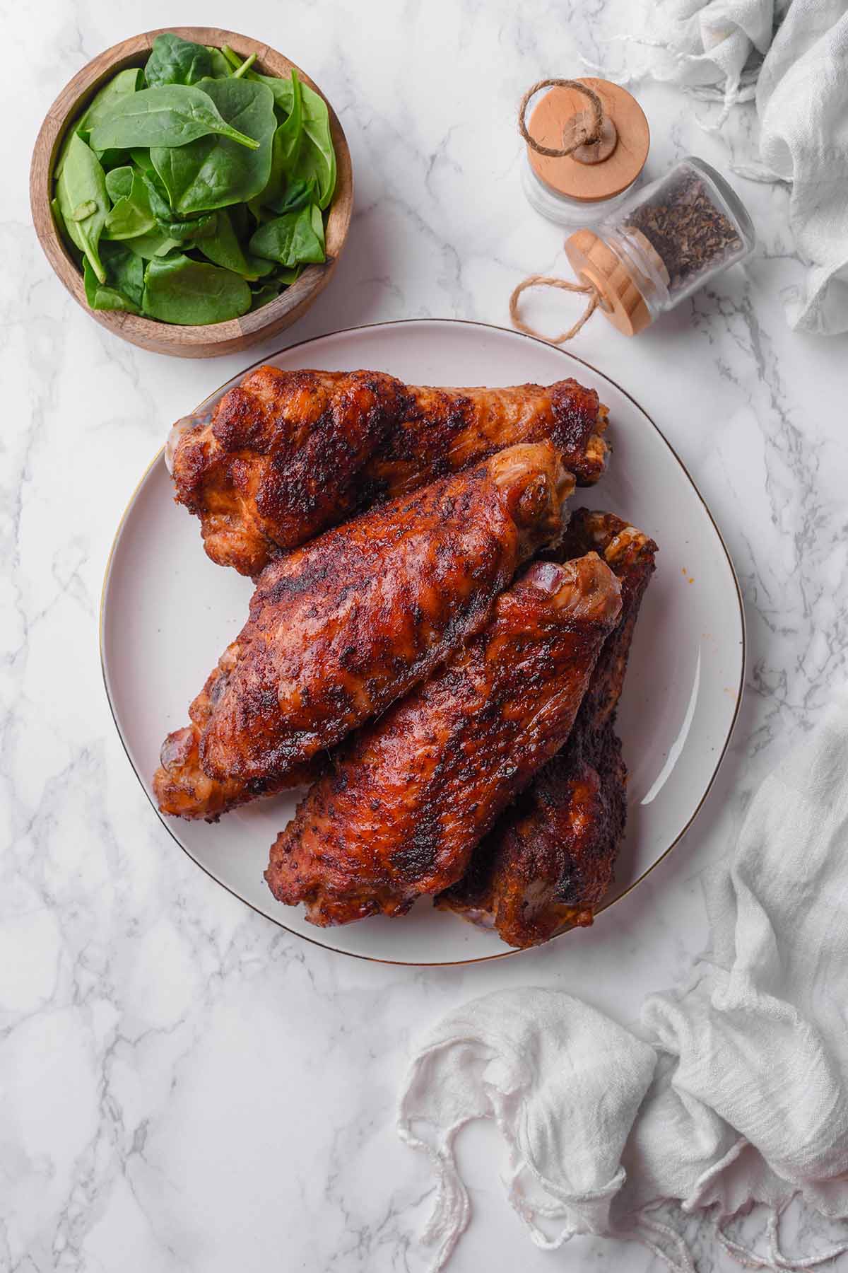 smoked turkey wings on a plate.