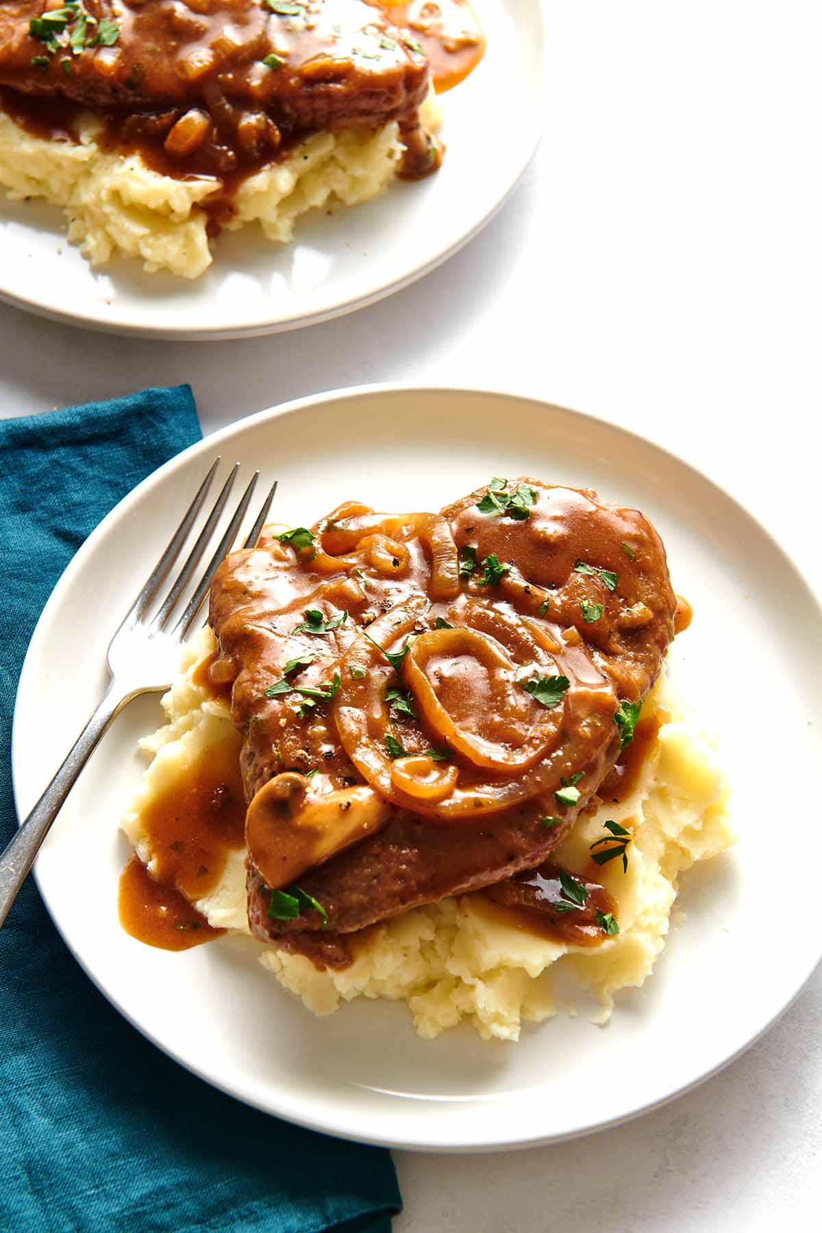 cube steak and gravy over mashed potatoes.