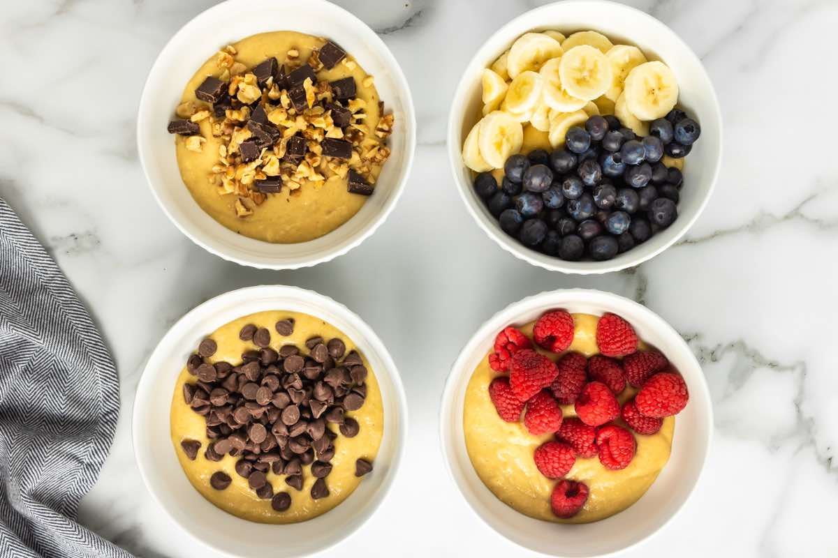 muffin batter in four bowls.