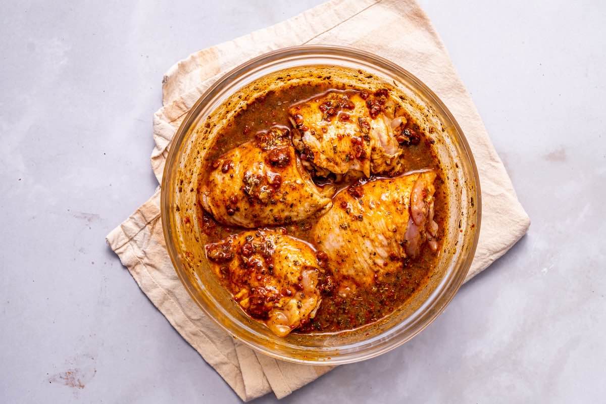 chicken soaking in marinade. 