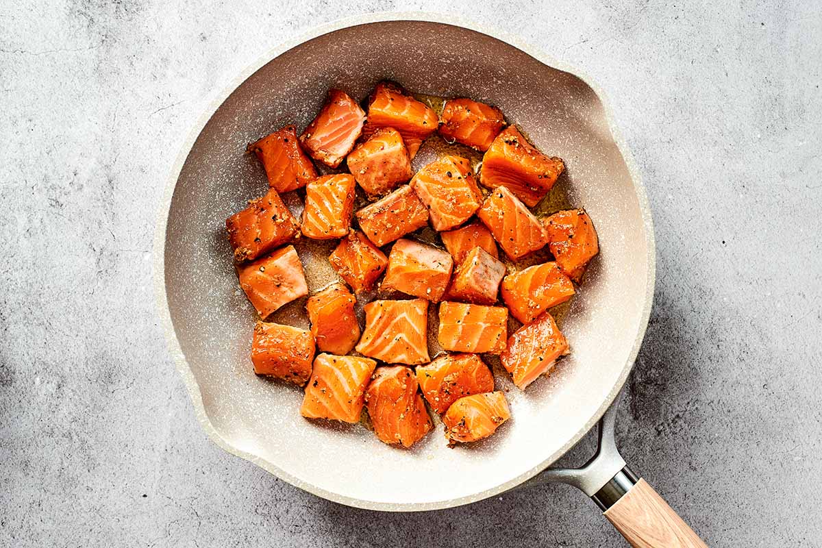 salmon cubes in skillet.