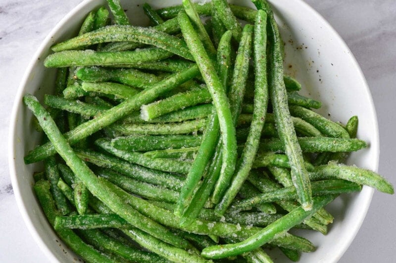 seasoned frozen green beans in bowl.