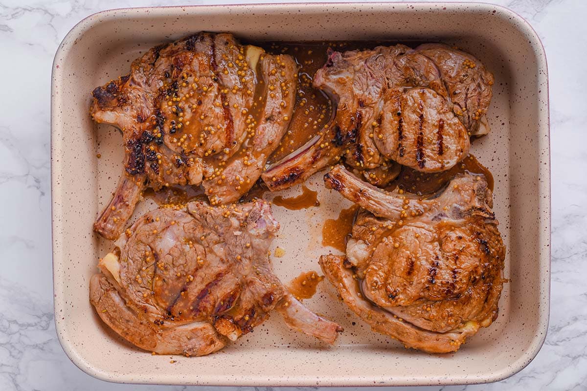 veal chops in baking dish.