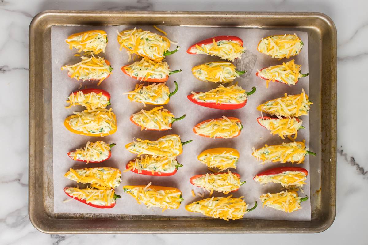 un-baked mini peppers with cheese.