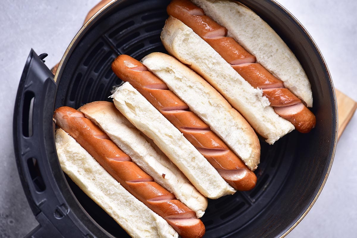 cooked hot dogs in buns.