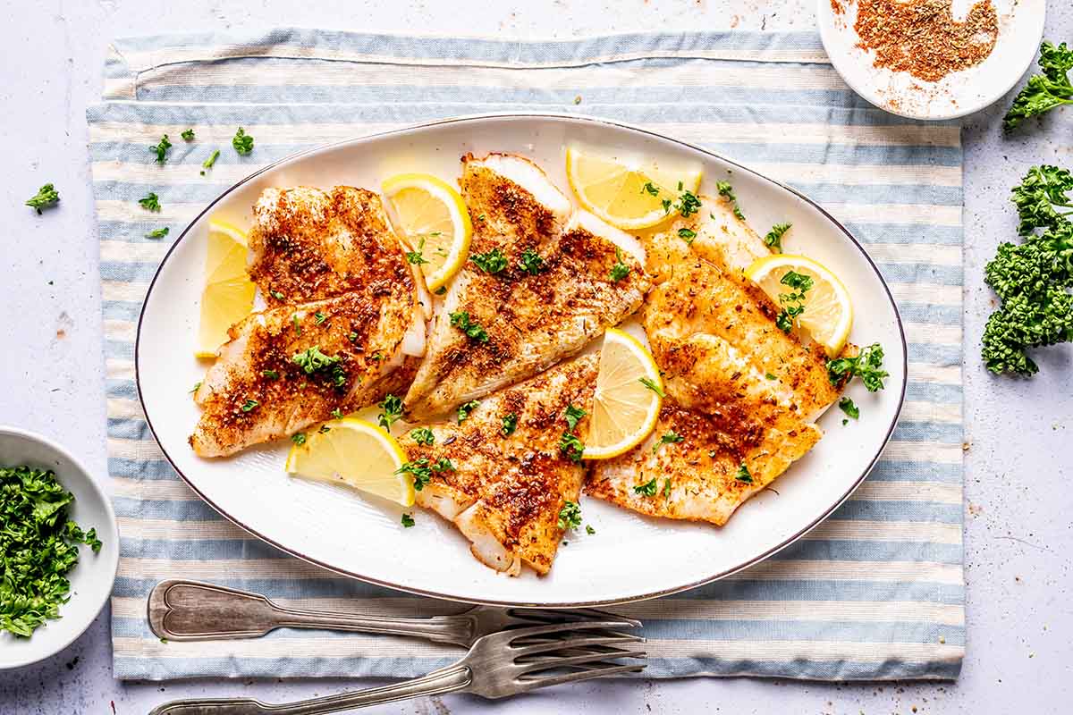 air fried cod with fresh lemon slices.