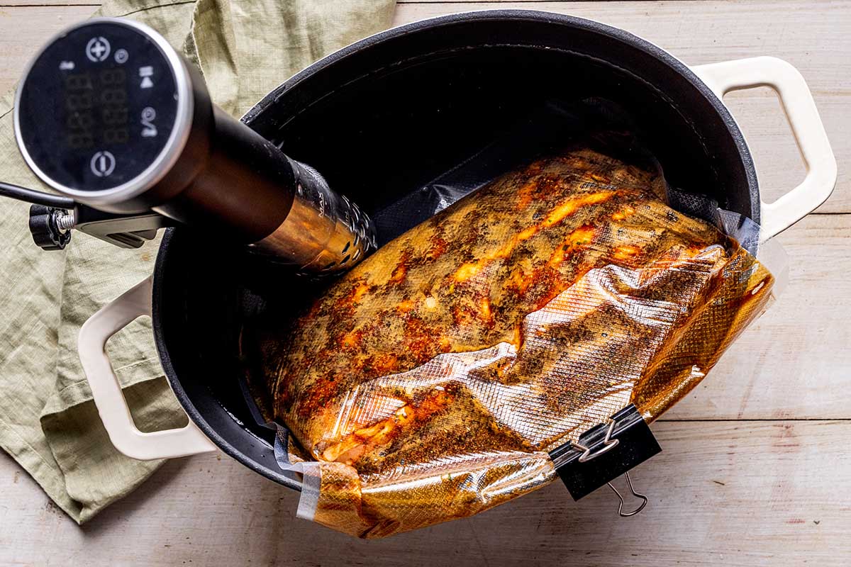 pork belly in vacuum bag in sous vide machine.