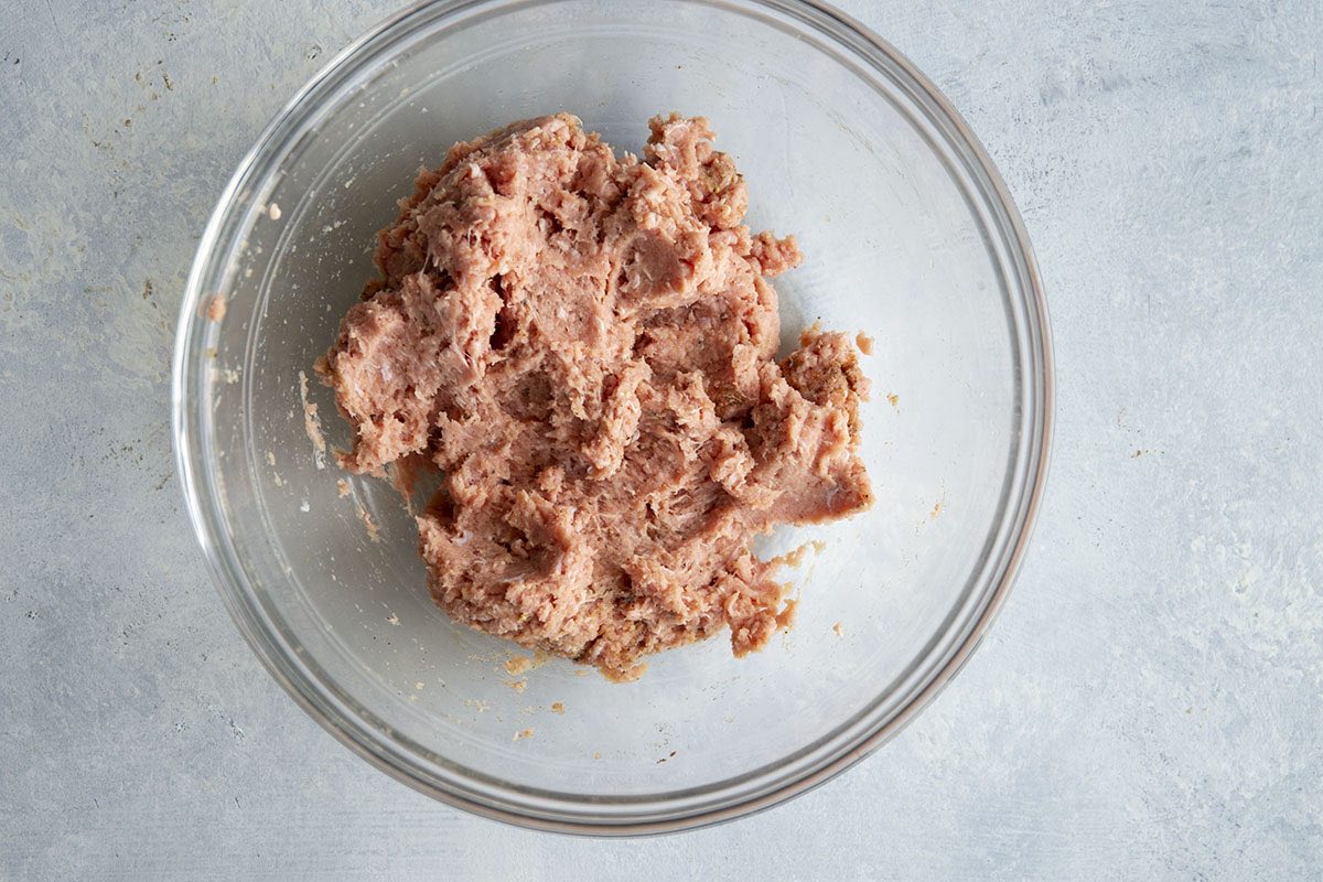 raw turkey sausage mixture in mixing bowl. 