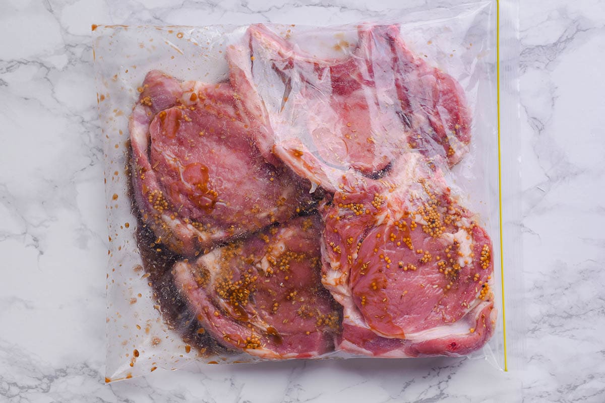 marinated veal chops in a ziplock bag.