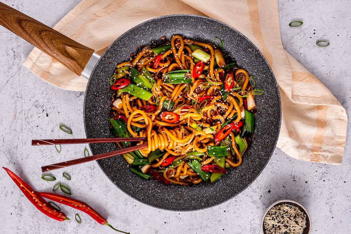 spicy asian noodles in pan.