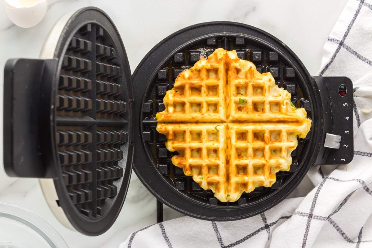 cooking savory waffles in a waffle iron.