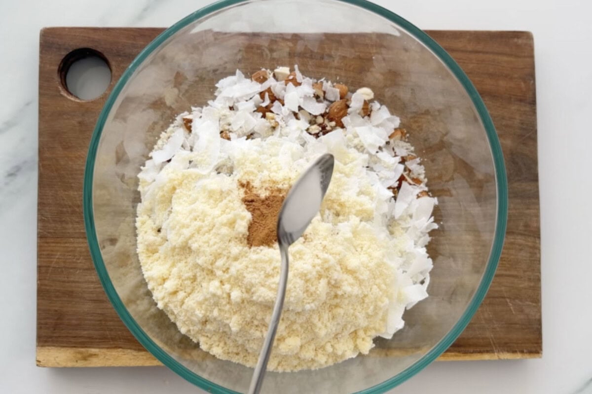 keto granola ingredients in a mixing bowl. 