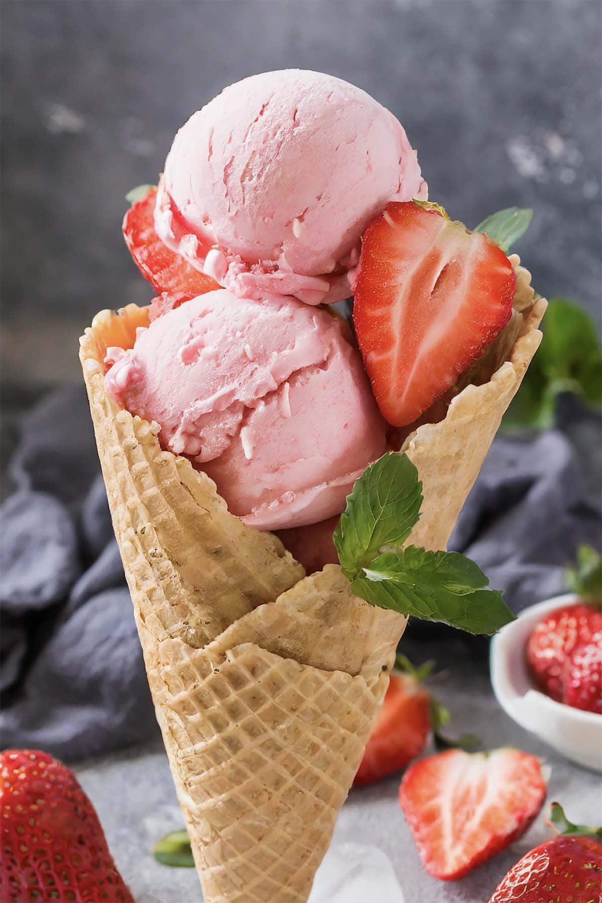 homemade strawberry ice cream in a cone.