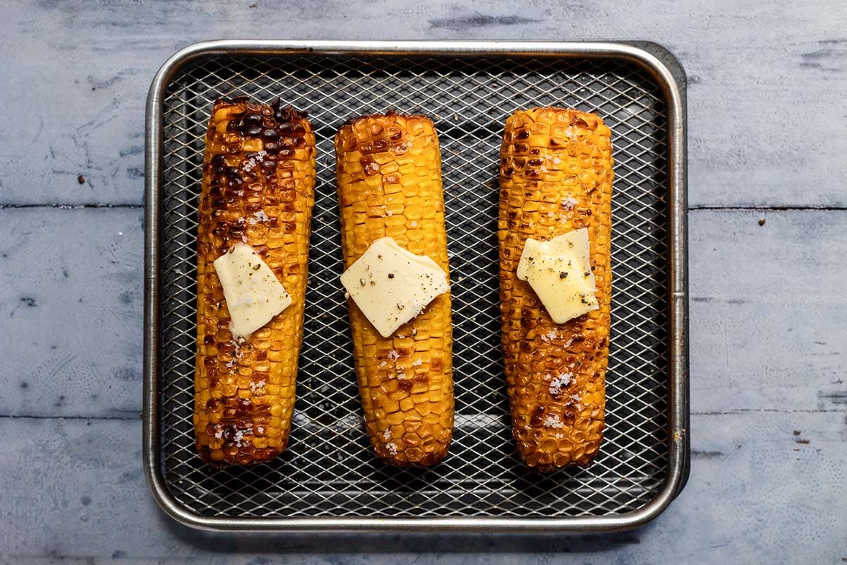 cooked corn on the air fryer tray.
