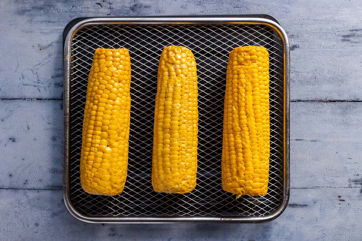 raw corn cobs on the air fryer.