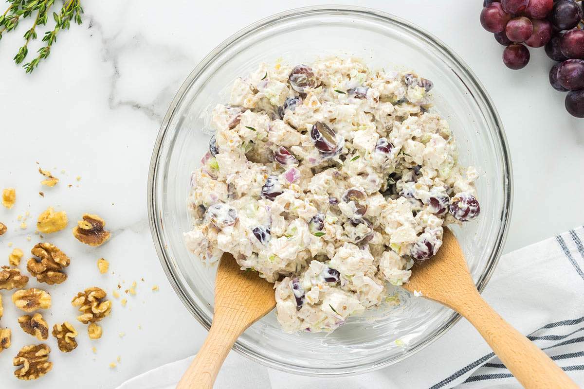 mixing keto chicken salad ingredients. 