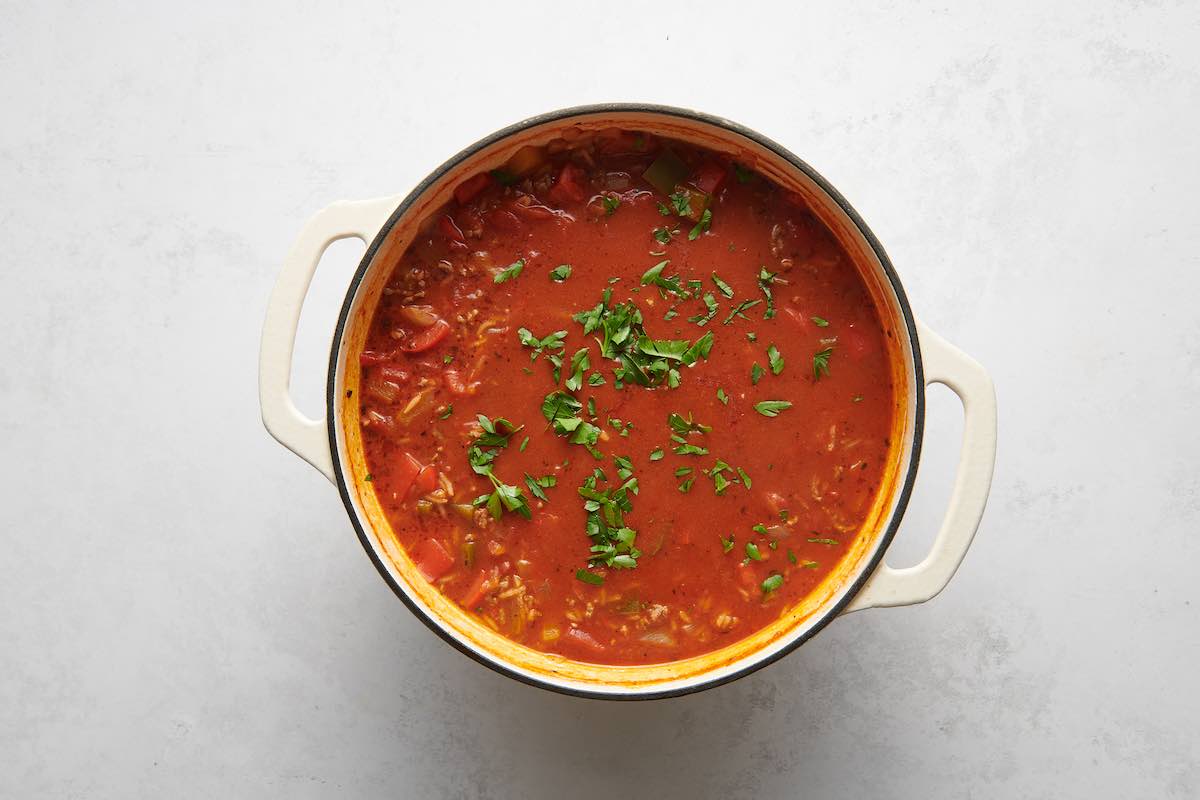 adding rice to soup pot.