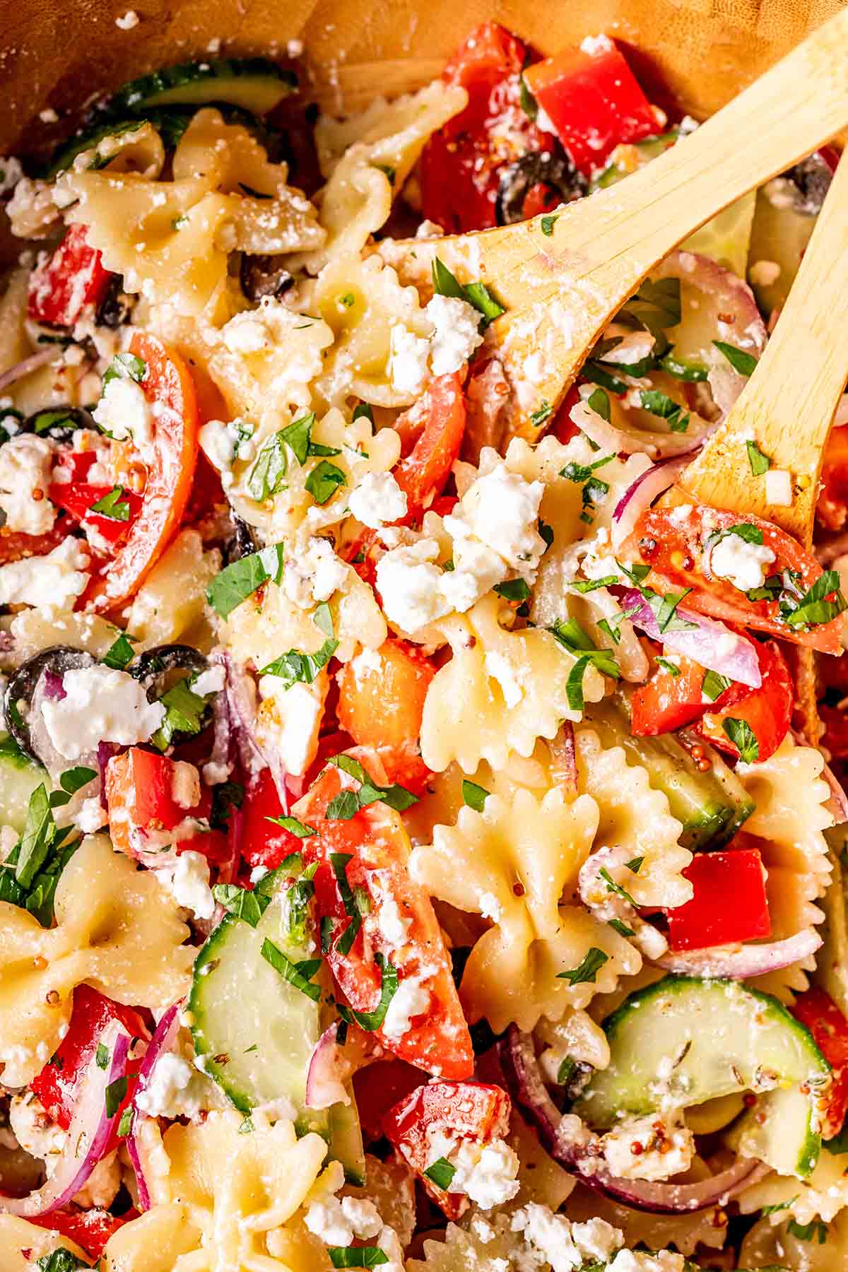 Healthy pasta salad with crumbled feta cheese on top.