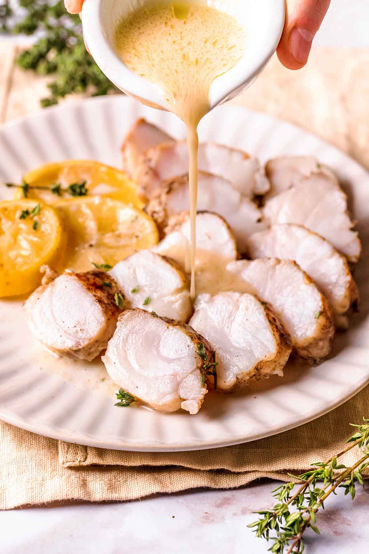 sliced monkfish with garlic butter sauce.