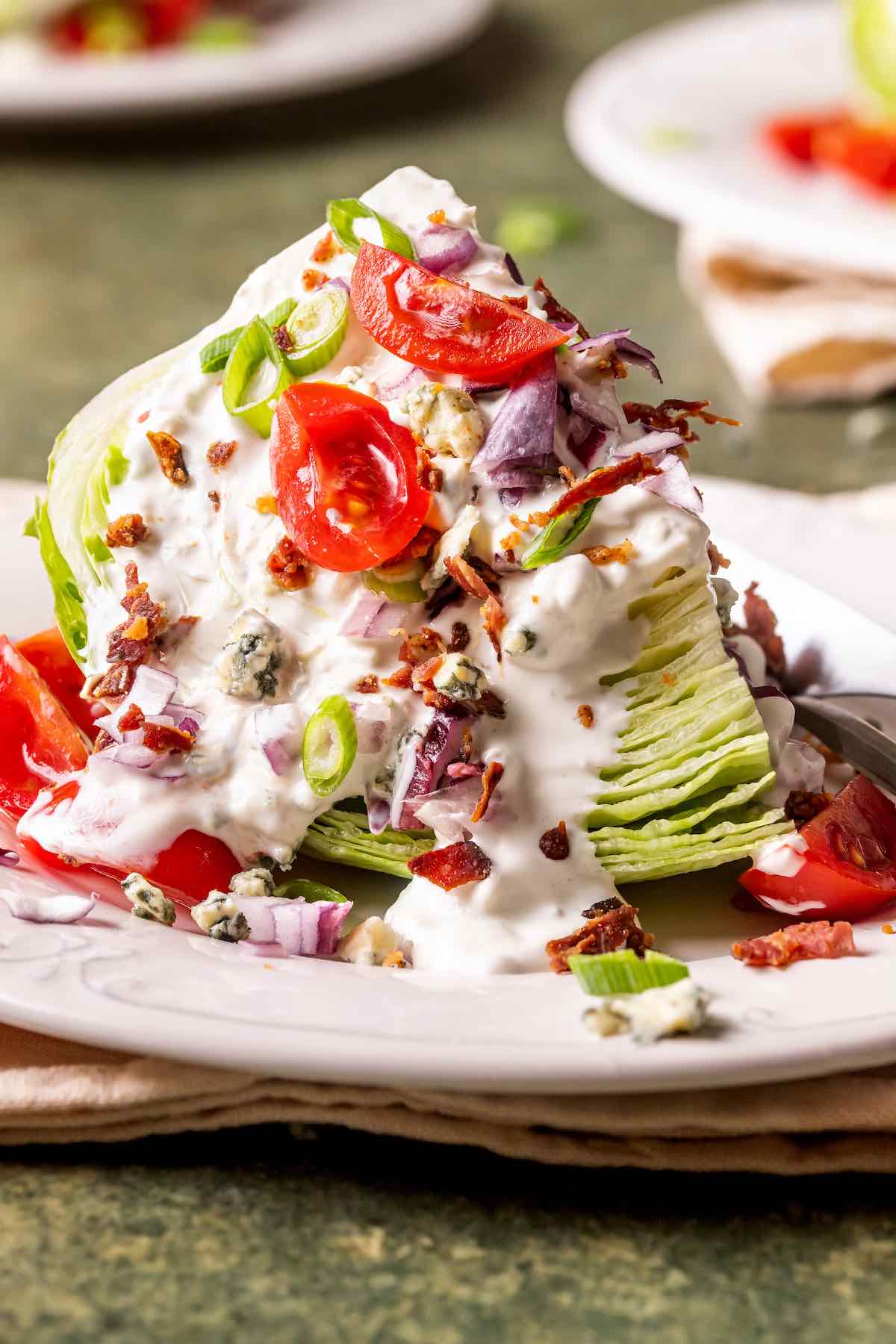 wedge salad on a white plate.