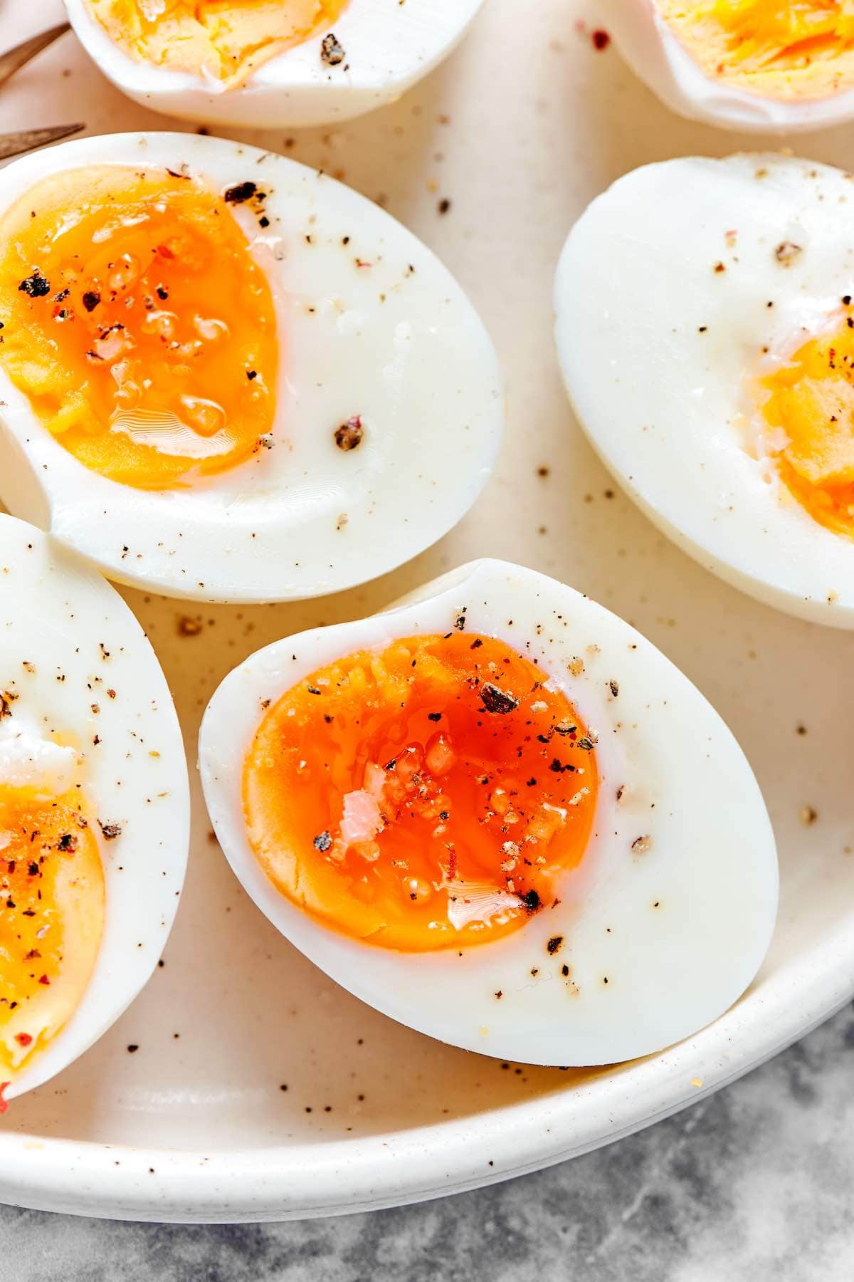 soft boiled eggs on a plate.