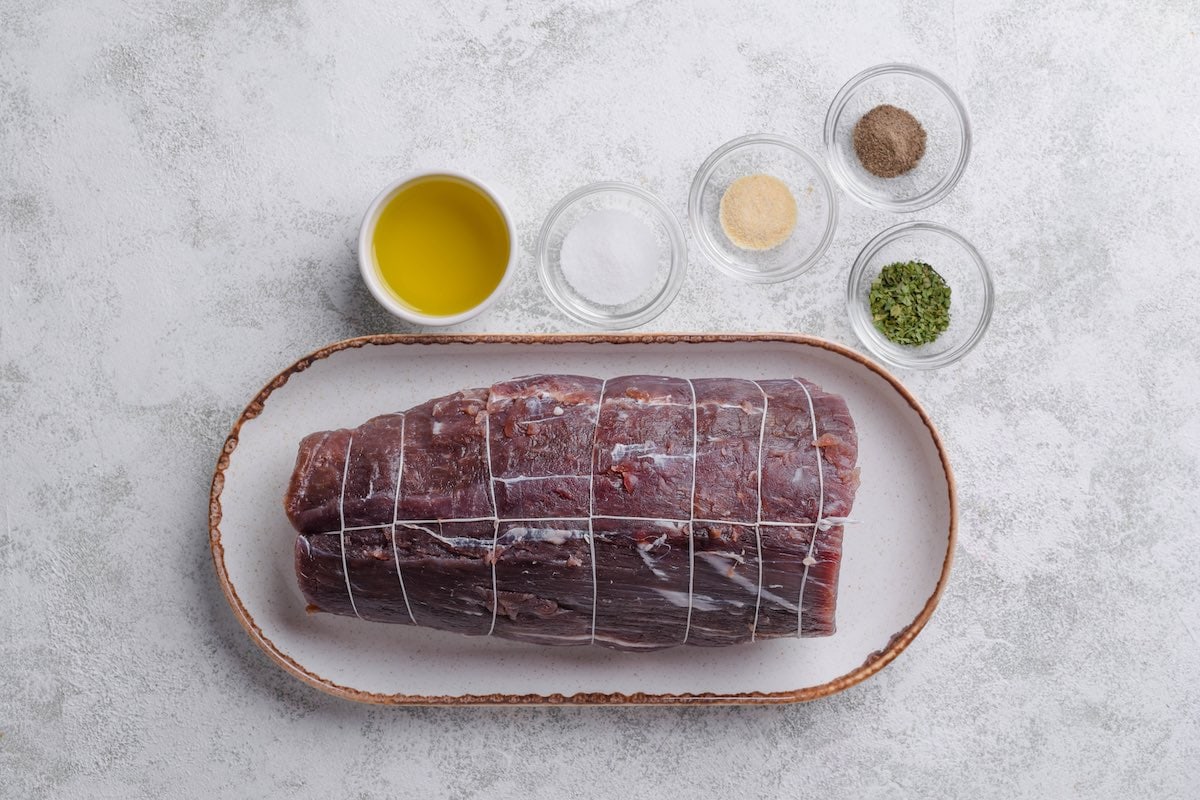 raw beef tenderloin and spices.