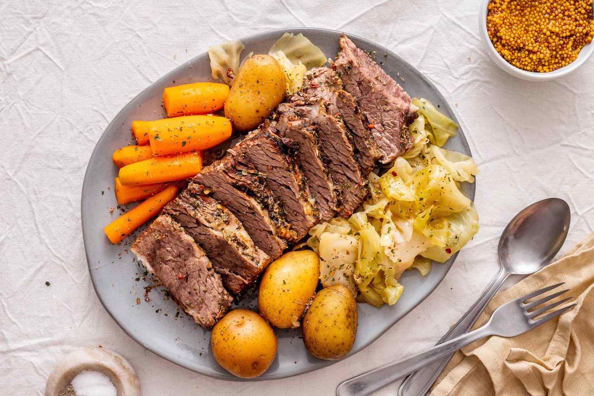 cooked brisket with vegetables.