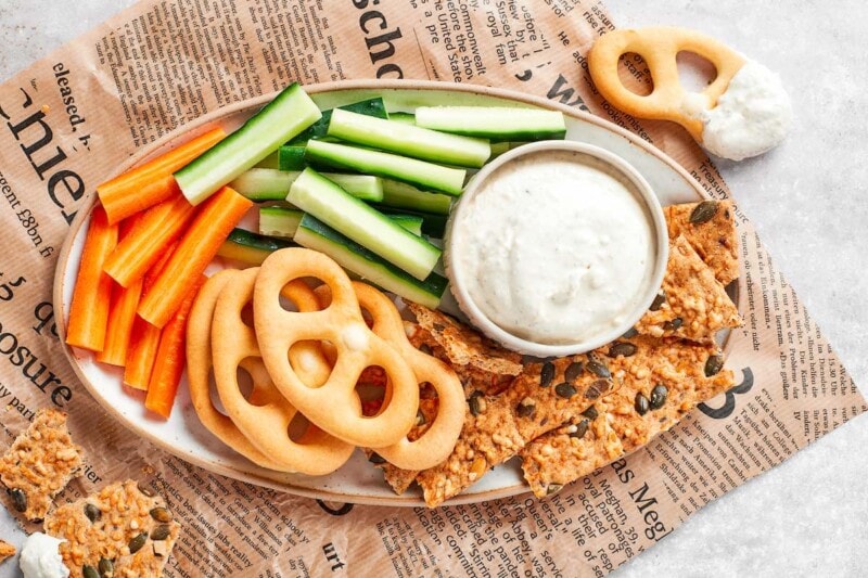 cottage cheese dip with pretzels, carrots, and cucumbers.