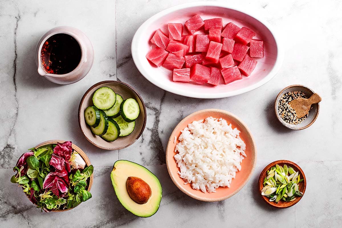 assembling a tuna poke bowl.