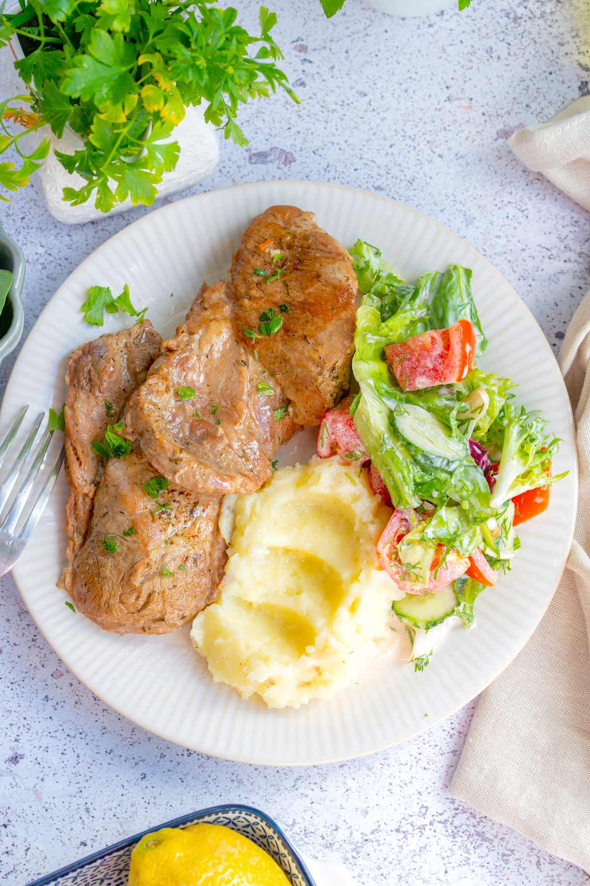 instant pot pork chops with mashed potatoes and salad.
