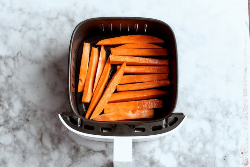 raw sweet potato fries in the air fryer.