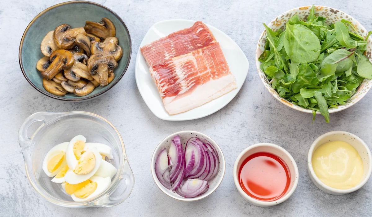 Spinach salad with warm bacon dressing ingredients.