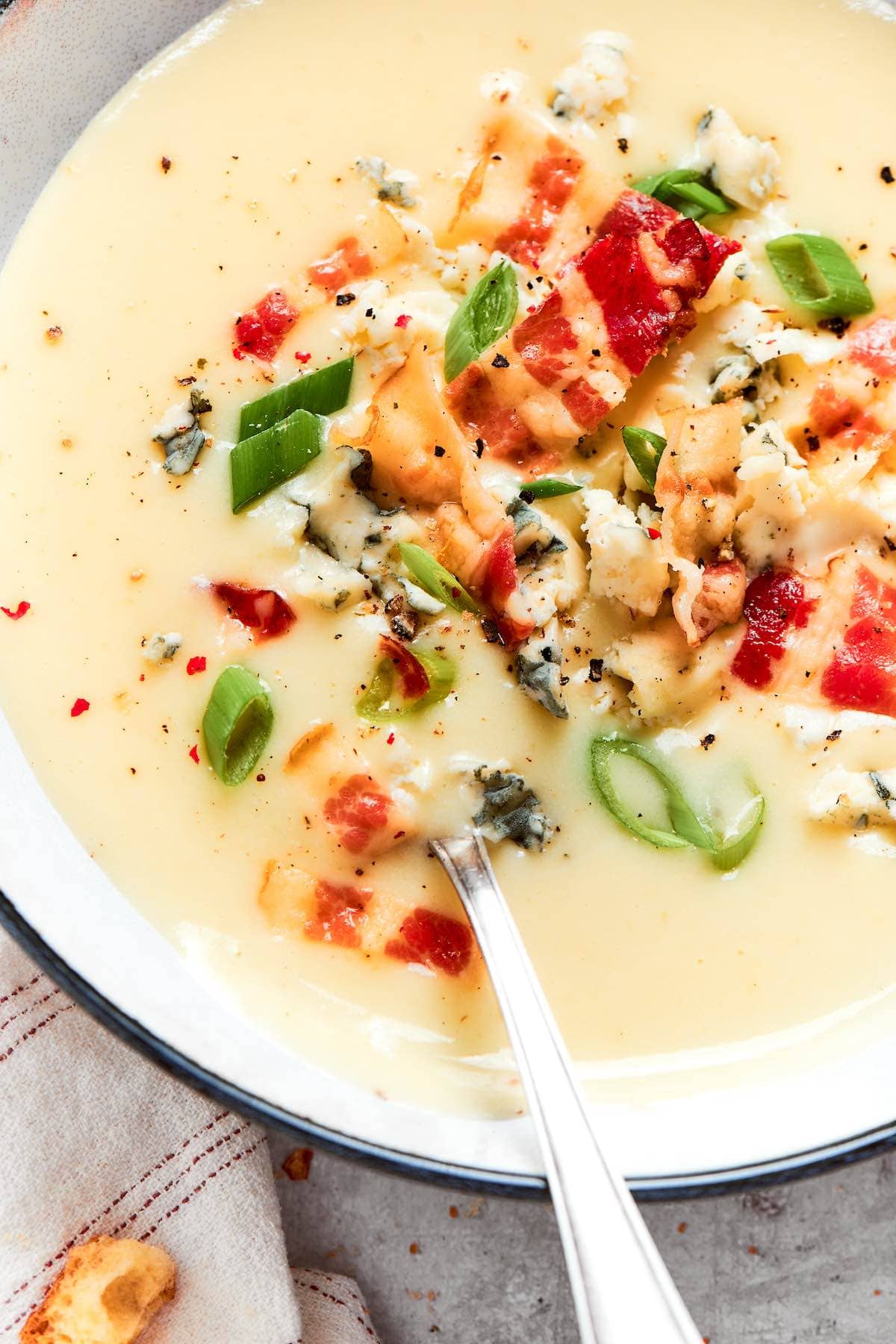 four ingredient potato soup with green onions and bacon.