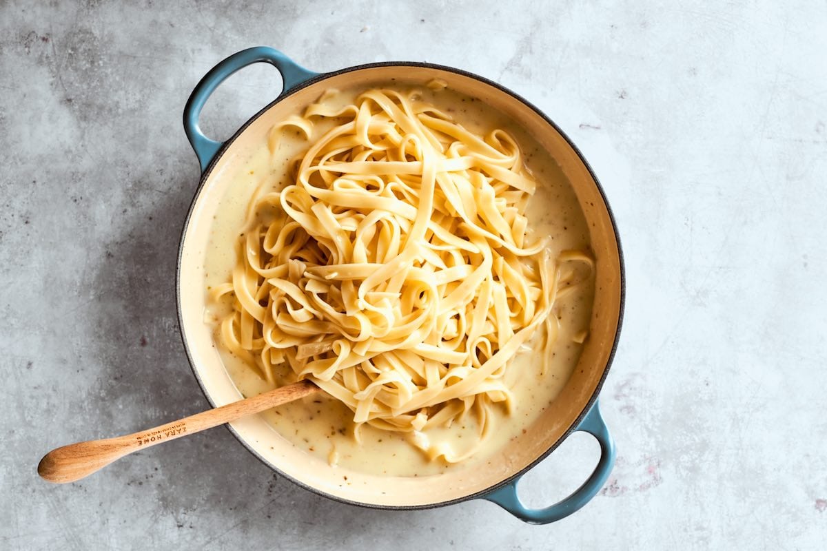 adding pasta to cottage cheese alfredo.