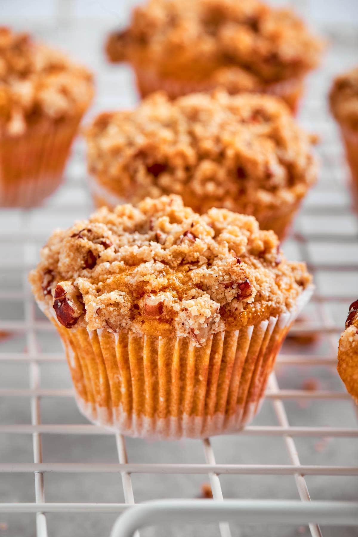pumpkin almond flour muffins on a wire rack.