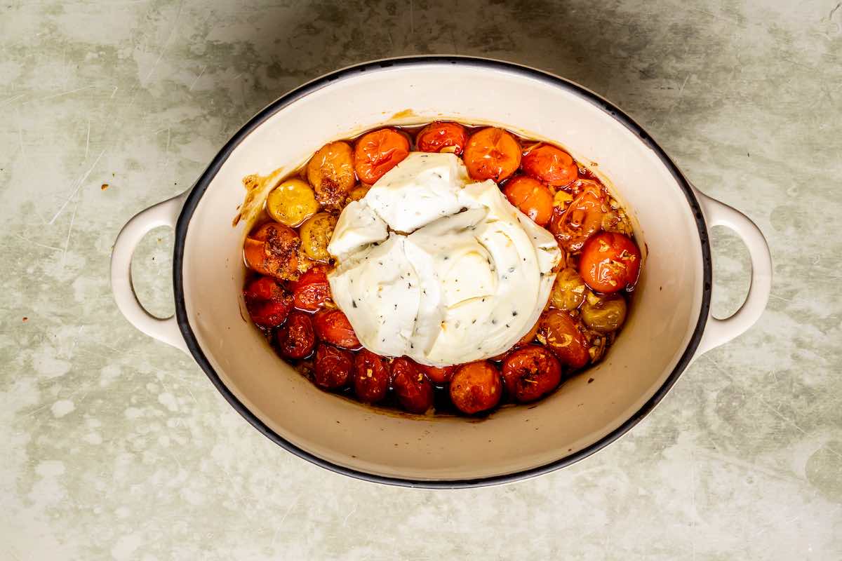 baked tomatoes and boursin cheese in a pot.