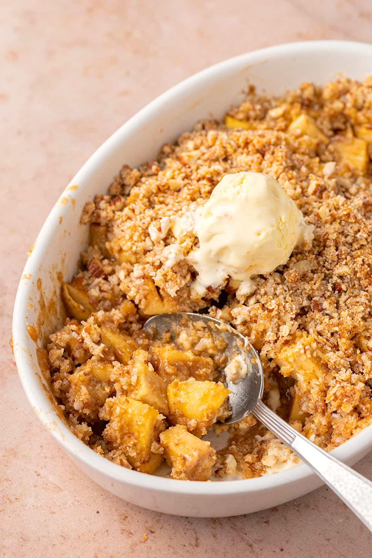 apple crisp with a scoop of vanilla ice cream.