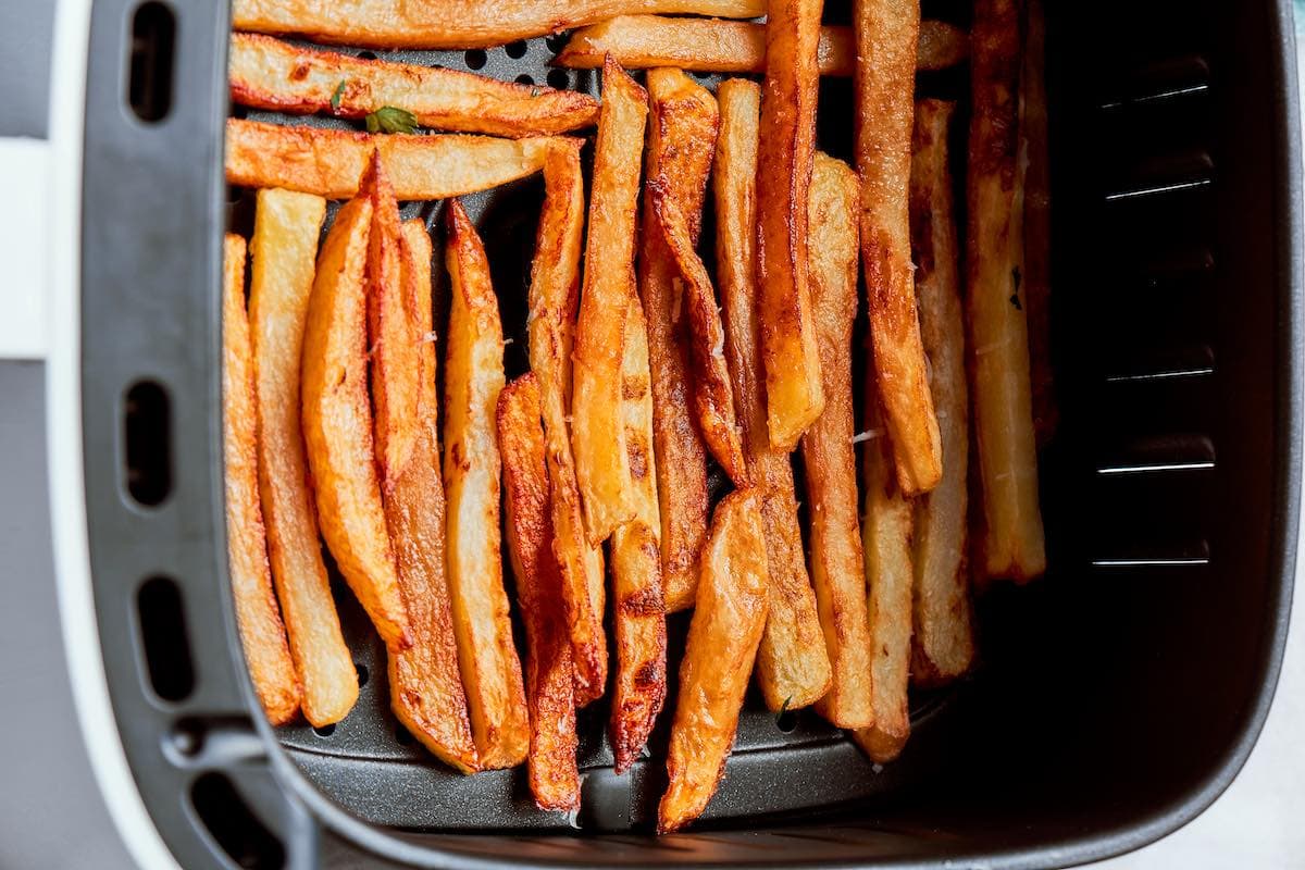 half-cooked french fries in the air fryer.