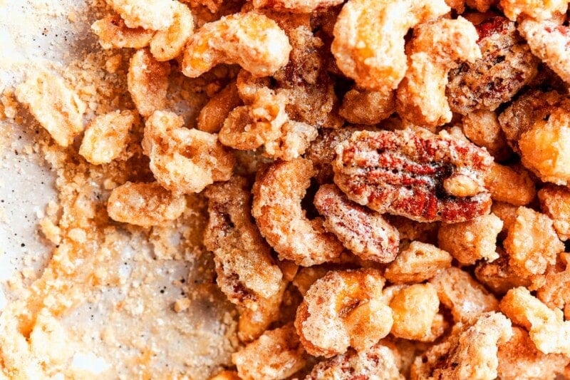 candied nuts setting on parchment paper.